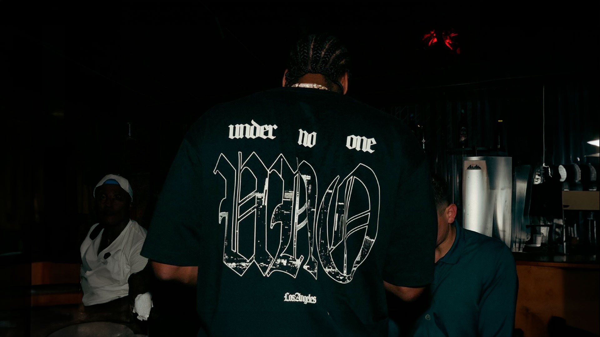 James Harden wearing Black t-shirt with small gothic-style 'UNO' text logo centered on chest in white outline design.